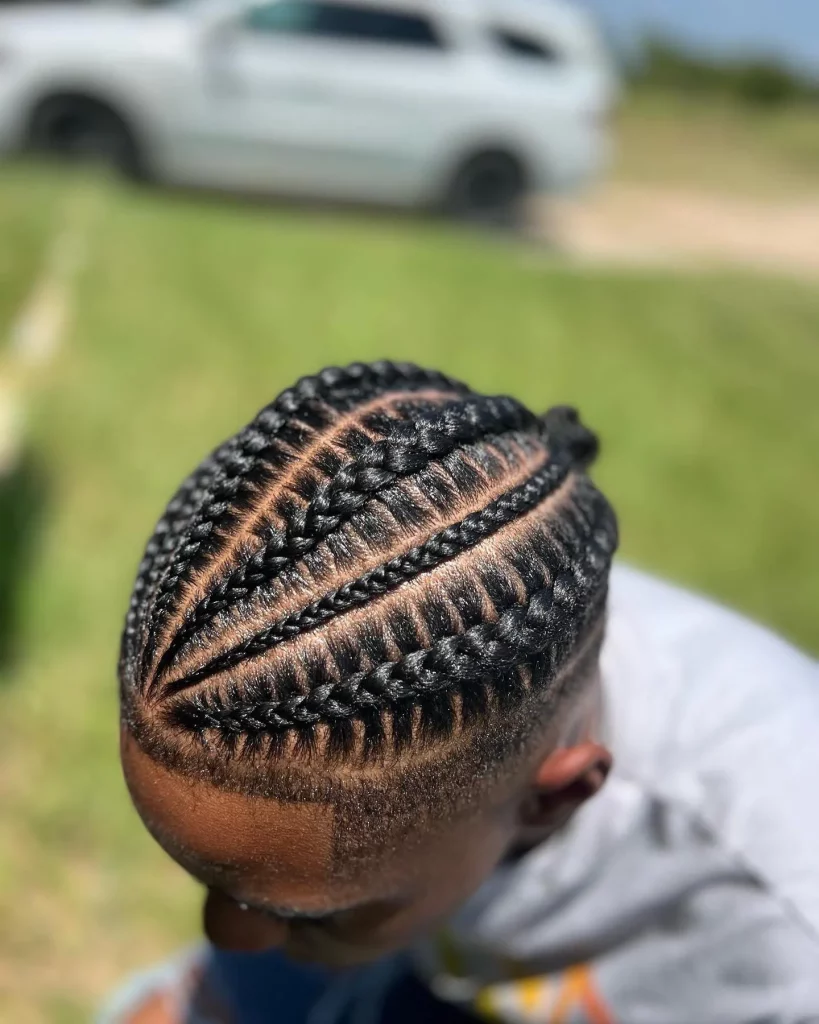 men stitch braids with bun